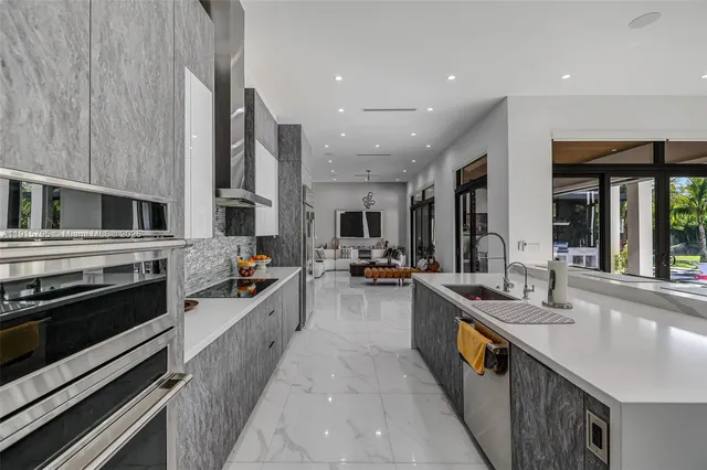 a bathroom with double vanity sinks a large mirror and a shower