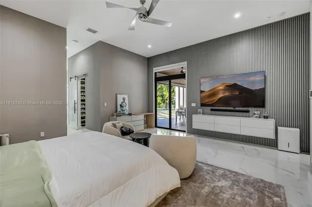 a bathroom with a sink vanity mirror and toilet
