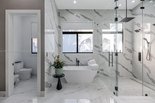 a utility room with sink dryer and washer