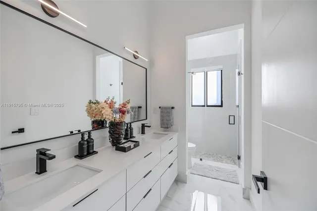 a view of a house with pool and chairs
