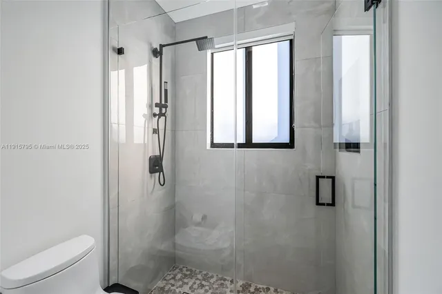 a view of an chairs and table on the patio