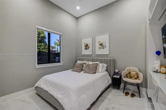 a view of a patio with table and chairs potted plants with wooden floor and fence