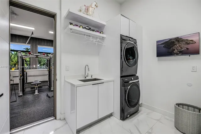 a bathroom with a sink a toilet a mirror and shower