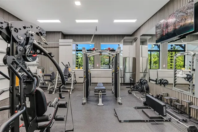 a view of a house with a big yard and large trees
