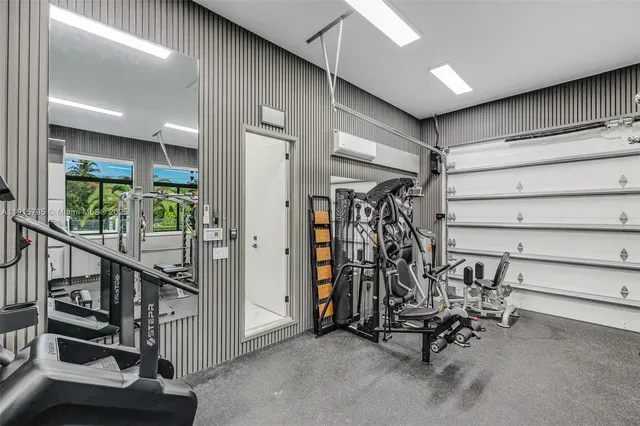 an aerial view of a house with garden space and outdoor seating