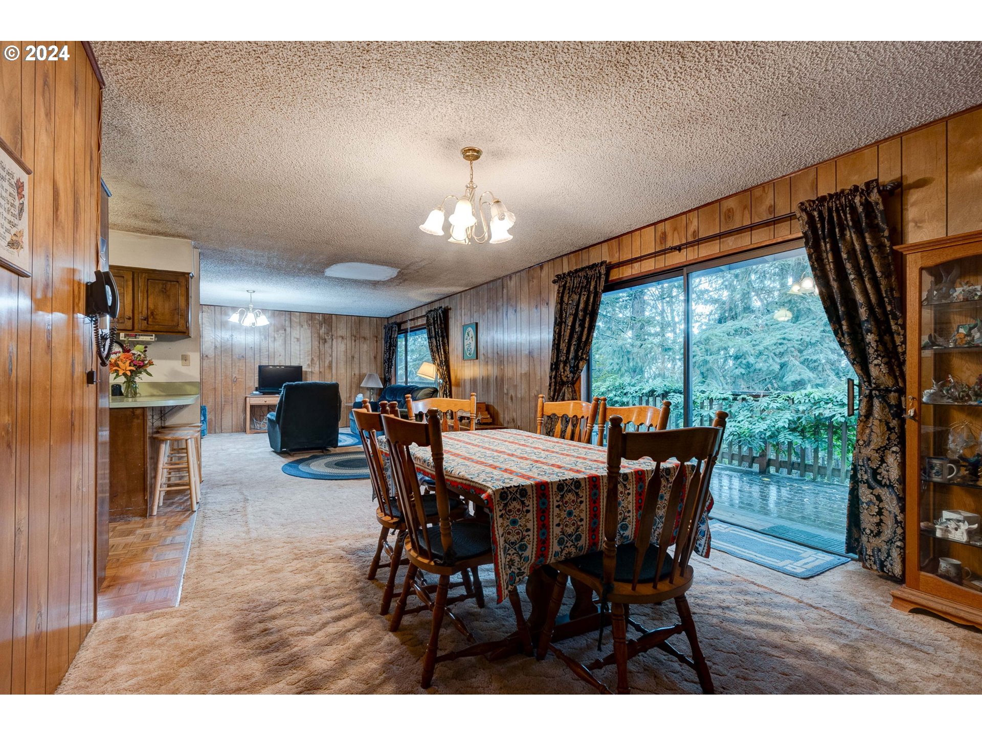 5634 South Whiskey Hill Road Hubbard, OR 97032 - Photo 13 of 48 a view of a dining room with furniture window and wooden floor