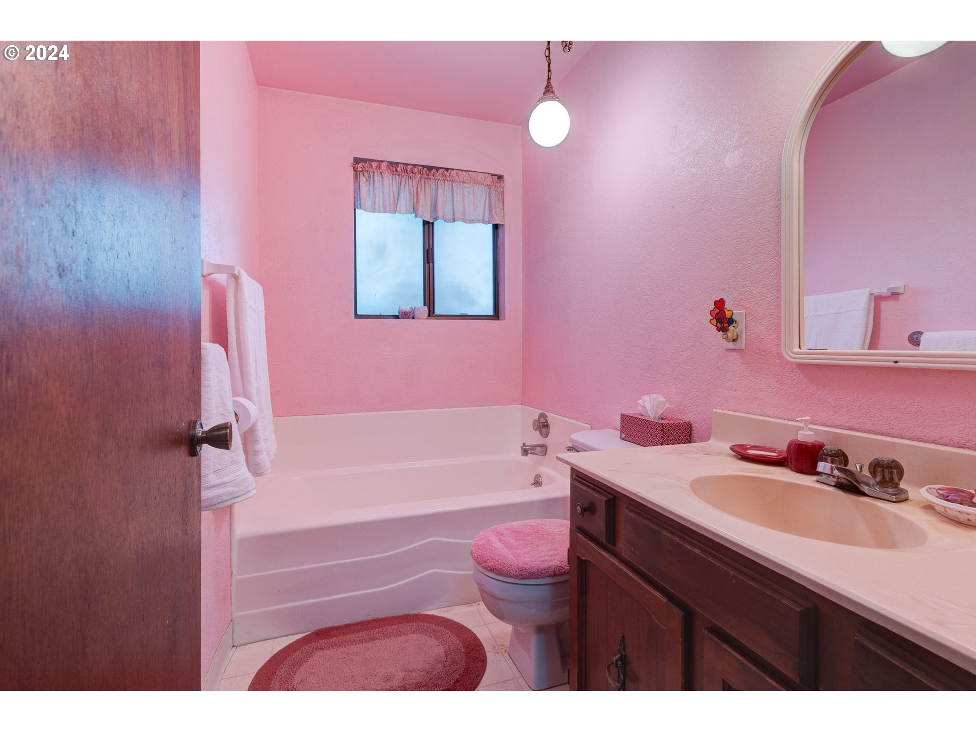 5634 South Whiskey Hill Road Hubbard, OR 97032 - Photo 23 of 48 a bathroom with a sink vanity tub and toilet