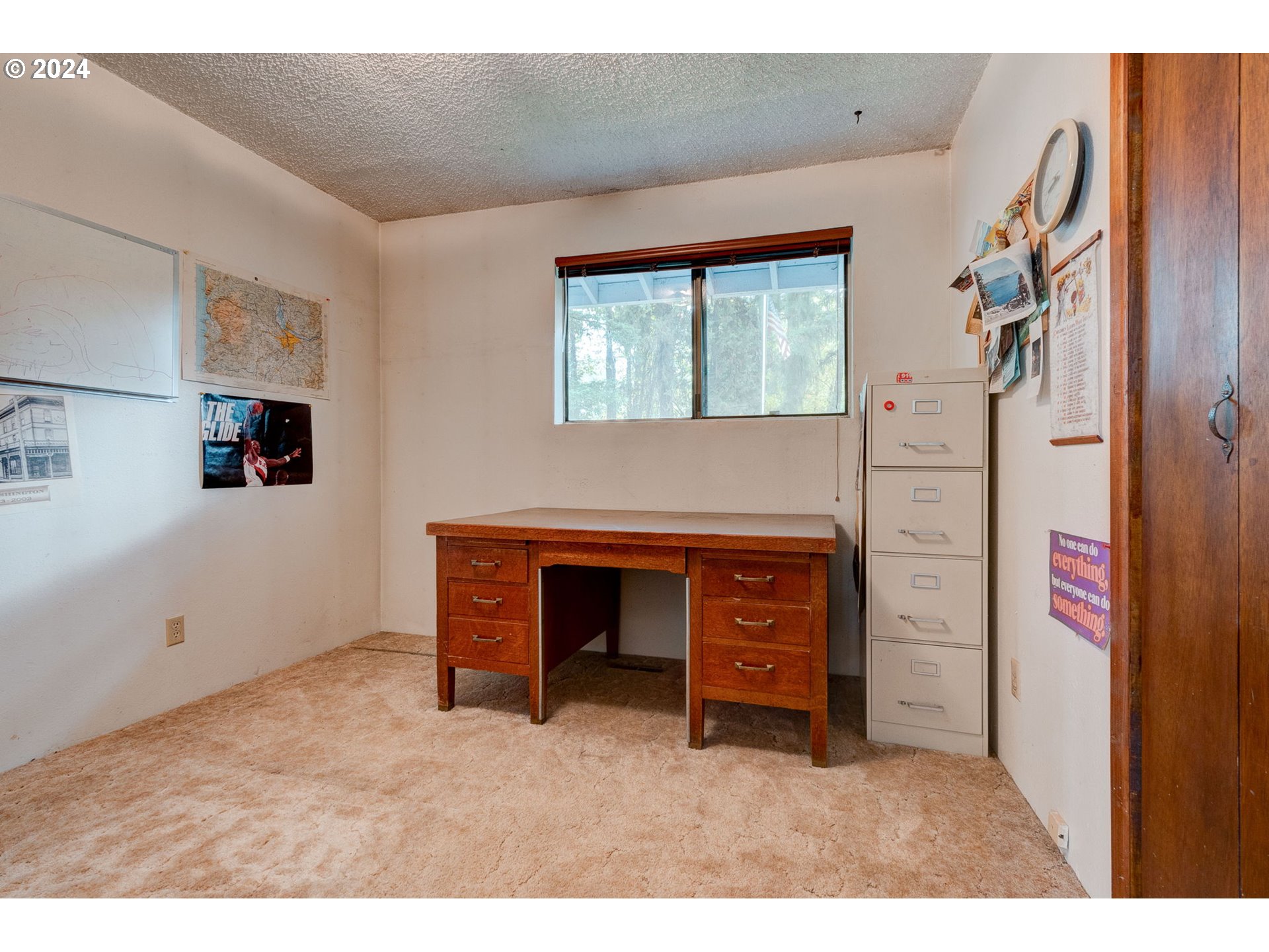5634 South Whiskey Hill Road Hubbard, OR 97032 - Photo 24 of 48 a view of an empty room with a fireplace and a window