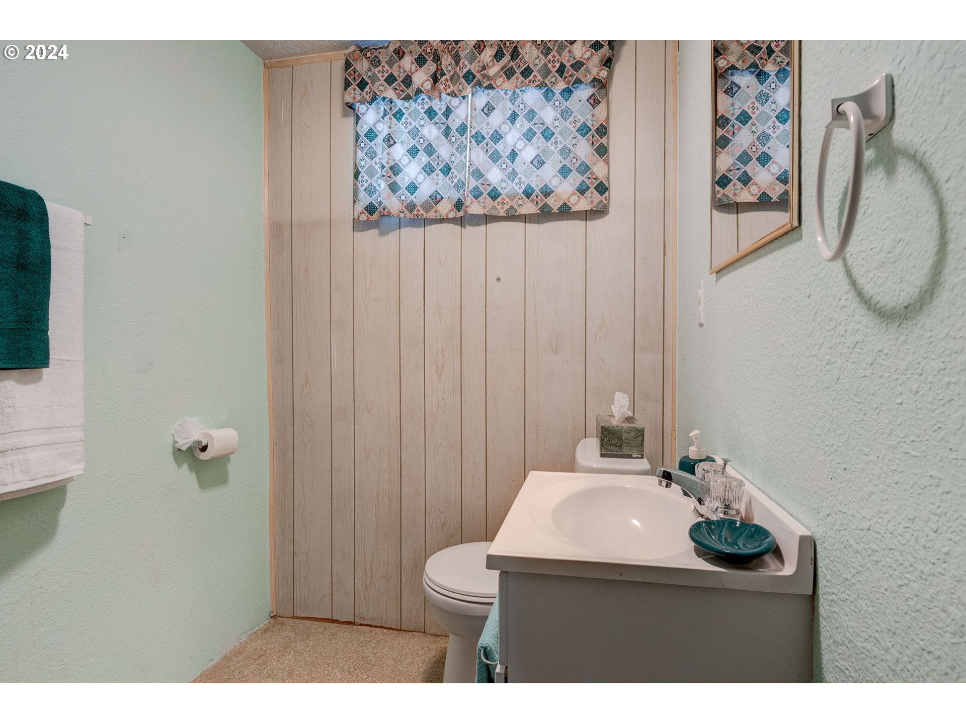 5634 South Whiskey Hill Road Hubbard, OR 97032 - Photo 30 of 48 a bathroom with a sink mirror and toilet