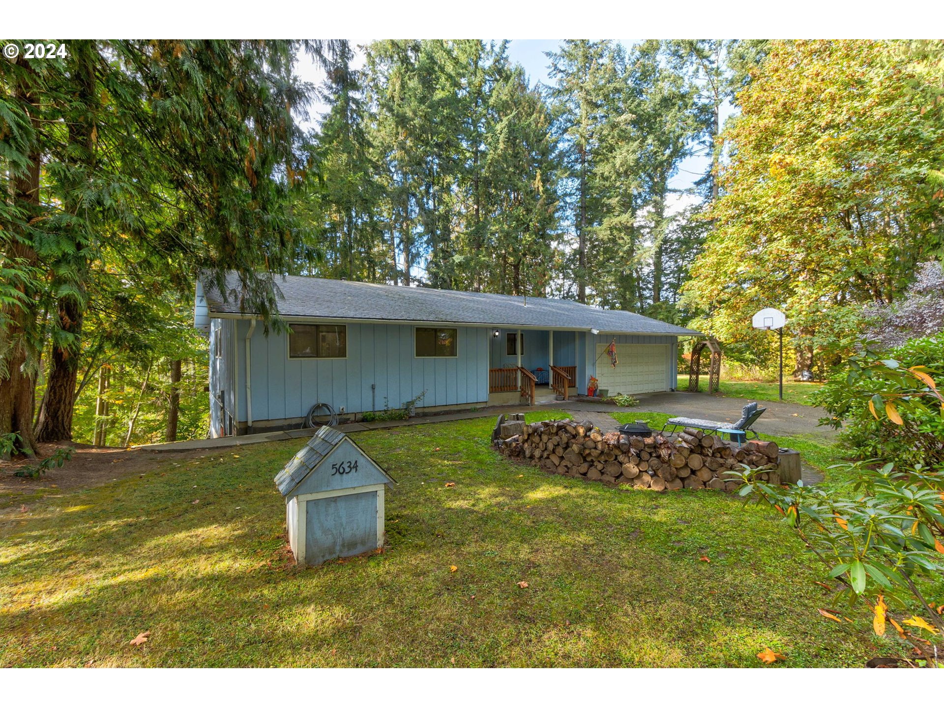 5634 South Whiskey Hill Road Hubbard, OR 97032 - Photo 3 of 48 a front view of house with yard having outdoor seating