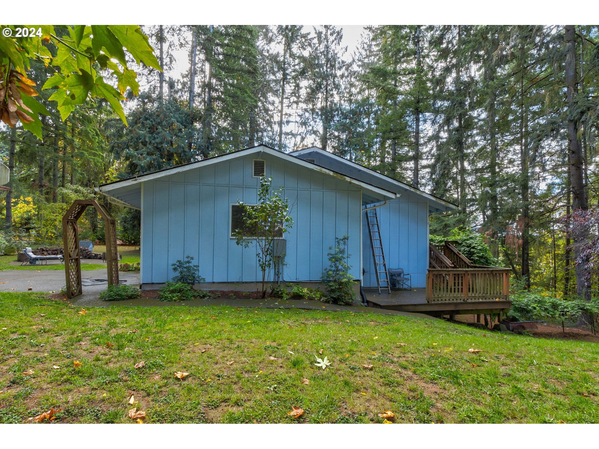 5634 South Whiskey Hill Road Hubbard, OR 97032 - Photo 40 of 48 a view of a backyard with a small cabin