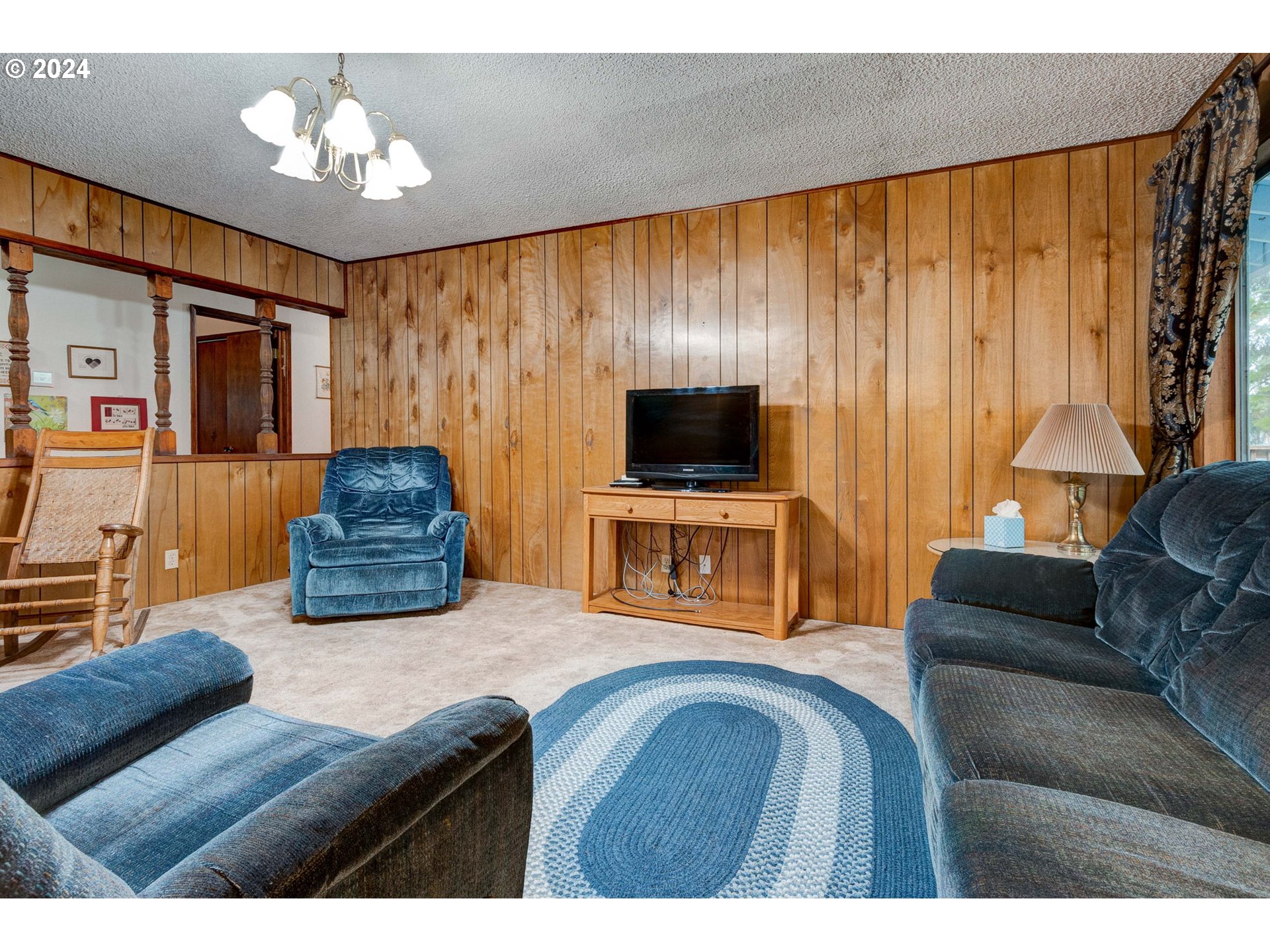 5634 South Whiskey Hill Road Hubbard, OR 97032 - Photo 10 of 48 a living room with furniture and a flat screen tv