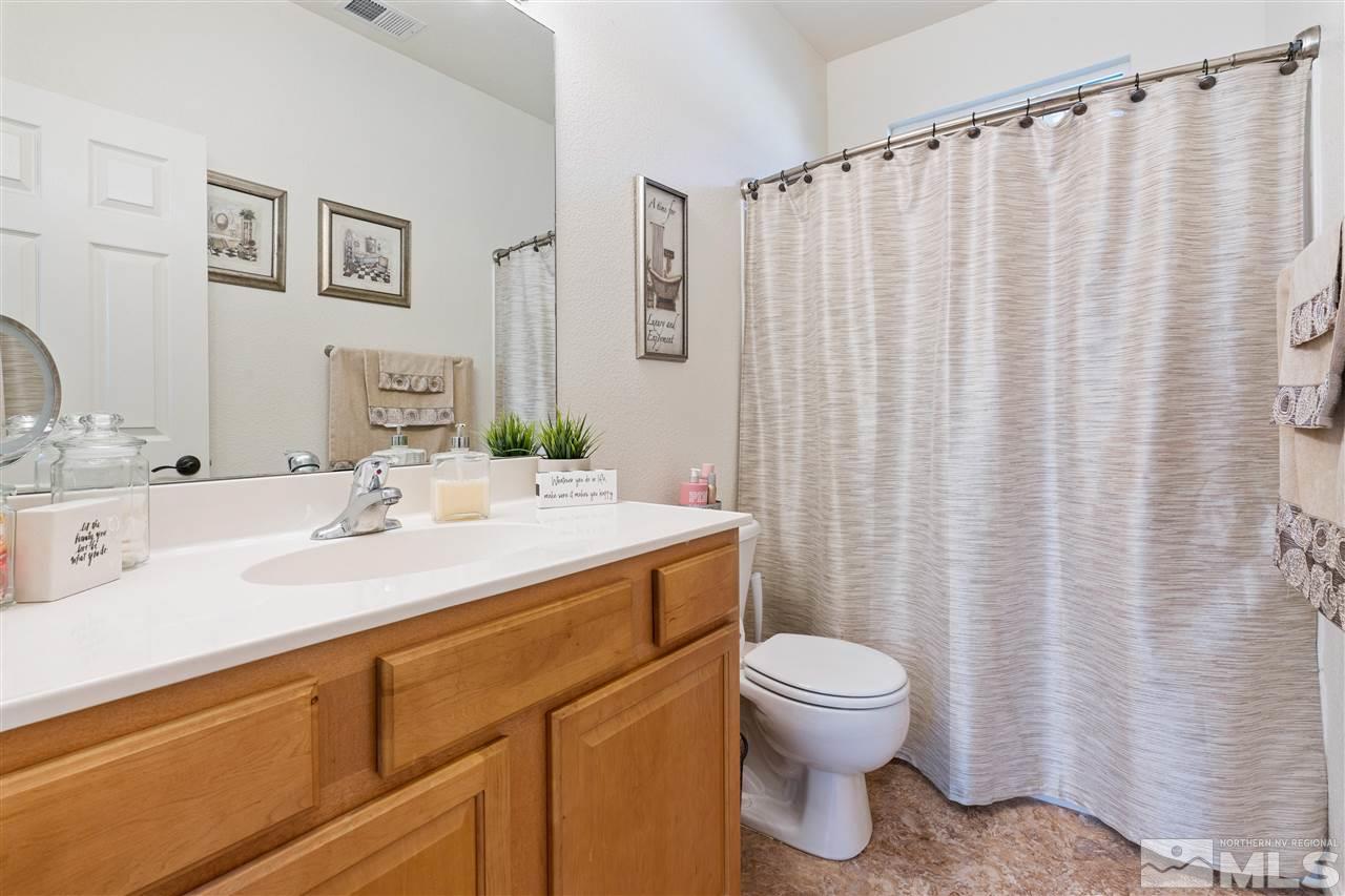 1859 Resistol Drive Reno, NV 89521 - Photo 21 of 33 a bathroom with a sink toilet and shower