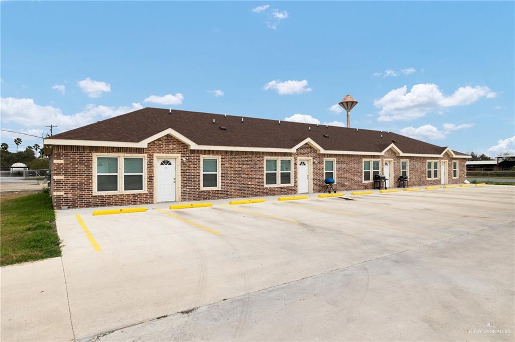 611 Cameron Street Progreso, TX 78579 - Photo 2 of 10 a front view of a house with a yard