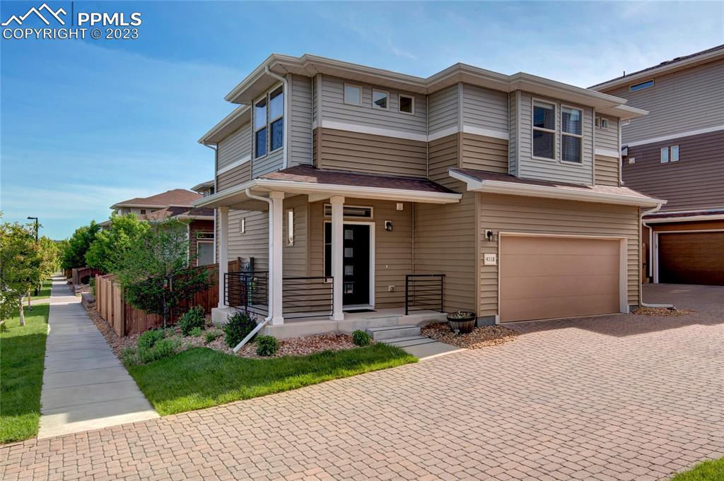 4118 Elegant Street Castle Rock, CO 80109 - Photo 1 of 26 a front view of a house with a yard