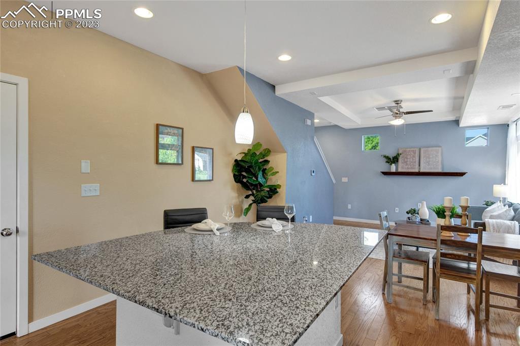 4118 Elegant Street Castle Rock, CO 80109 - Photo 13 of 26 a kitchen with stainless steel appliances granite countertop a stove a sink and a wooden cabinets