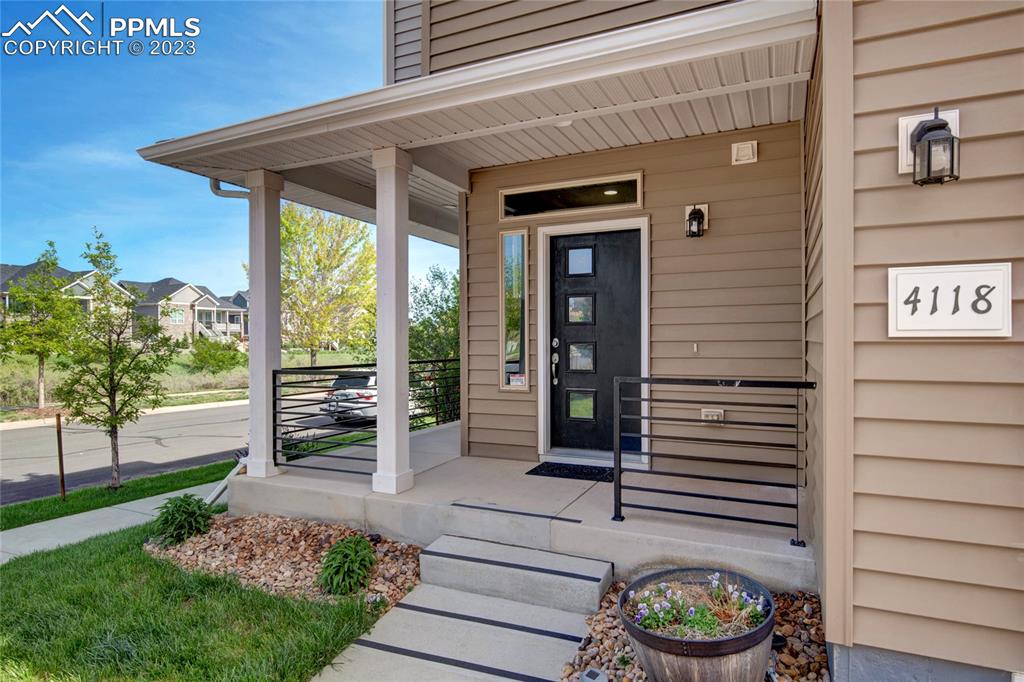 4118 Elegant Street Castle Rock, CO 80109 - Photo 4 of 26 a view of a porch with a bench