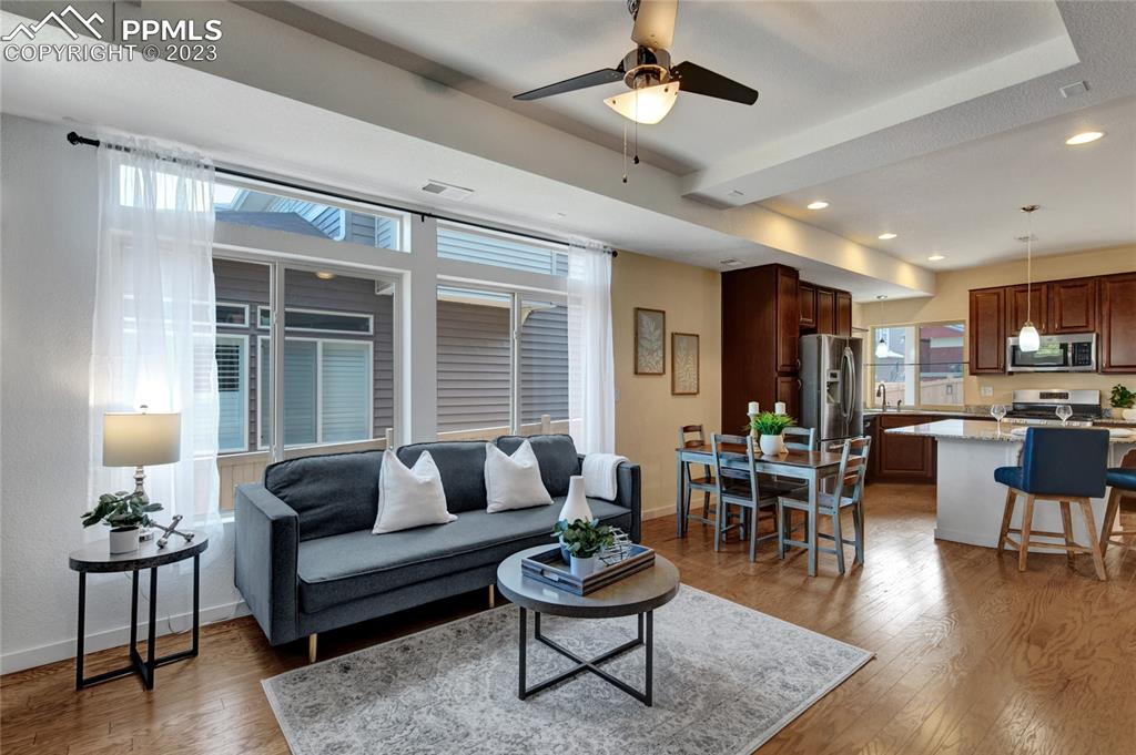4118 Elegant Street Castle Rock, CO 80109 - Photo 6 of 26 a living room with furniture and a large window