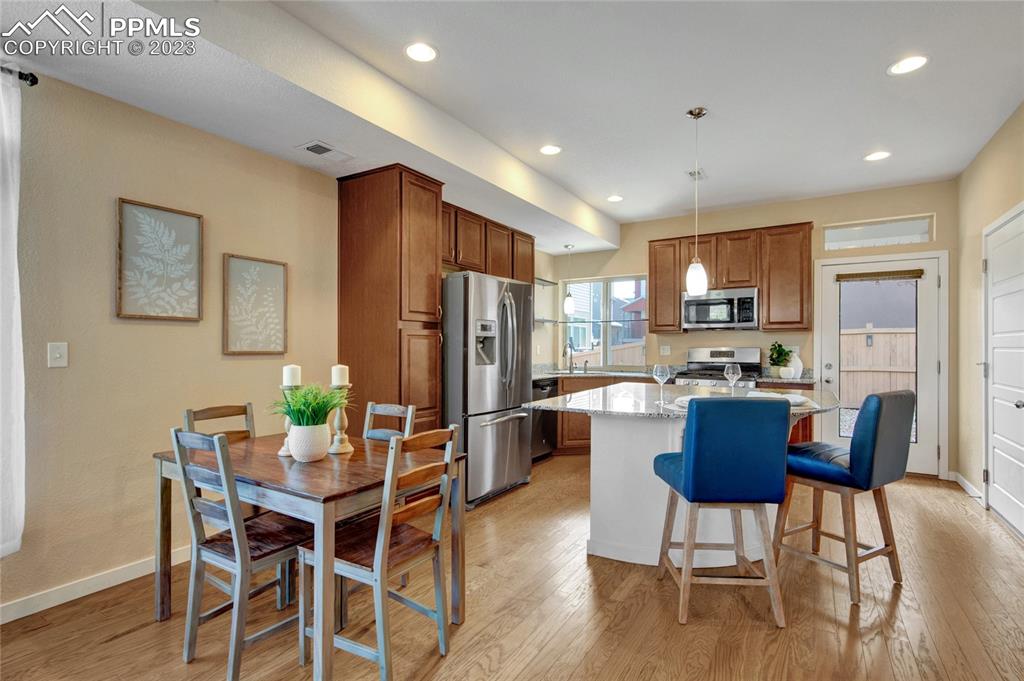 4118 Elegant Street Castle Rock, CO 80109 - Photo 9 of 26 a view of a dining room with furniture