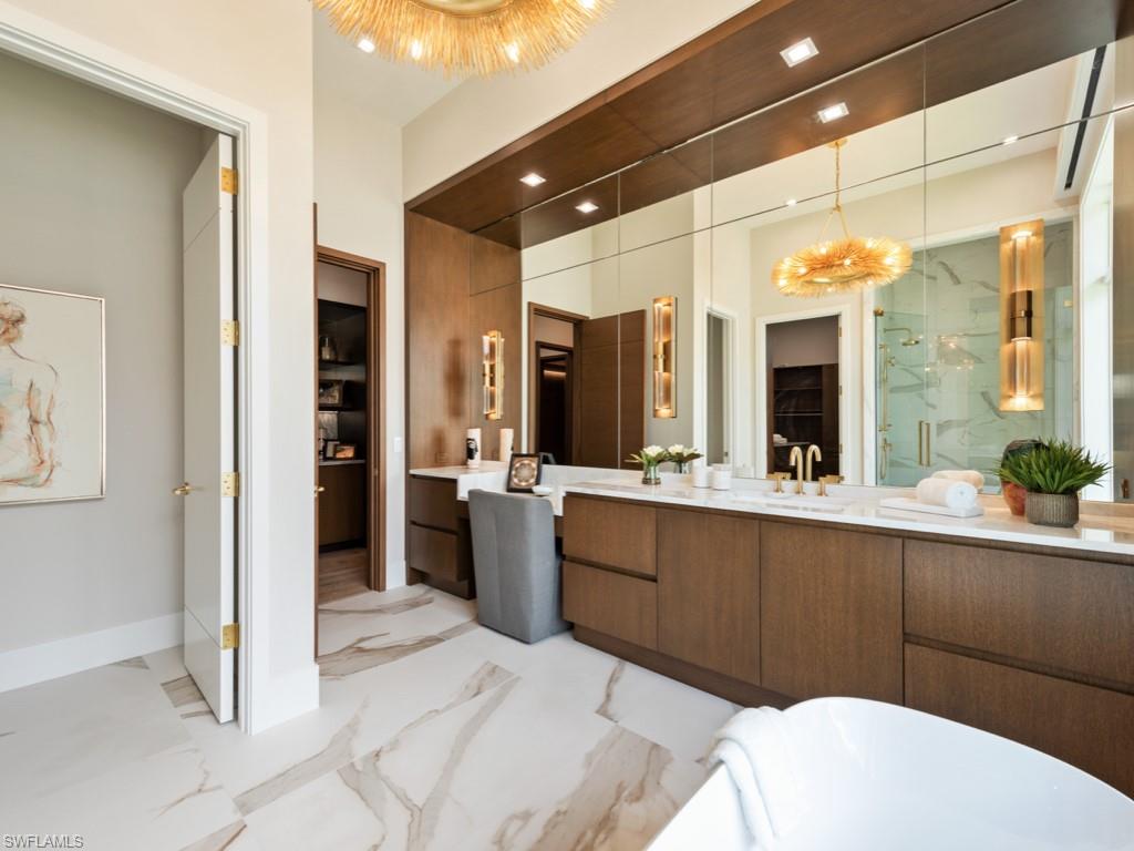 349 Colony Drive Naples, FL 34108 - Photo 25 of 48 Bathroom with vanity and shower with separate bathtub