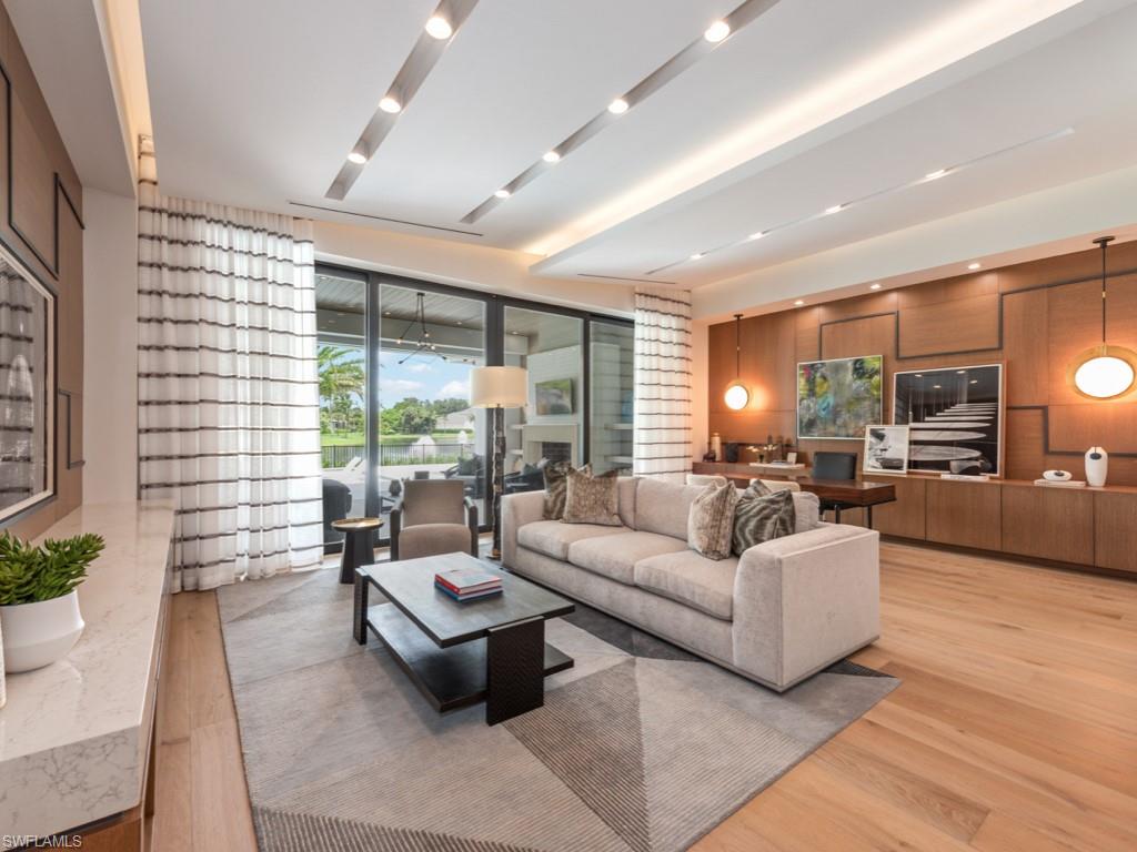 349 Colony Drive Naples, FL 34108 - Photo 38 of 48 Living room featuring wood-type flooring