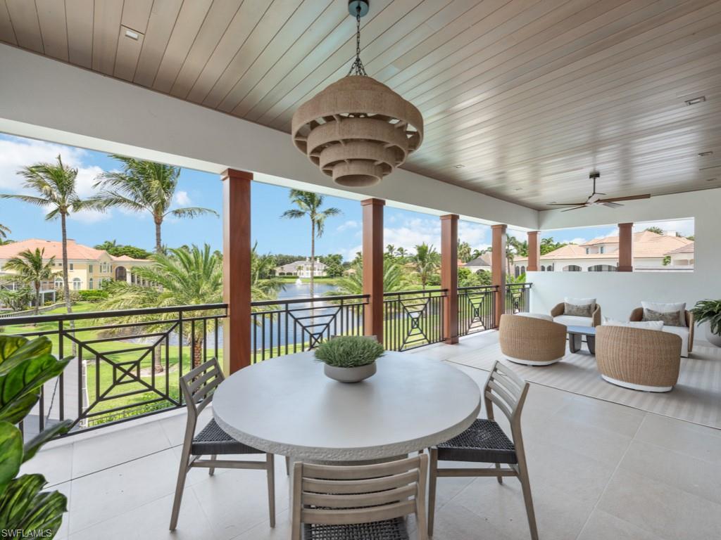349 Colony Drive Naples, FL 34108 - Photo 42 of 48 Sunroom featuring a water view, ceiling fan, a wealth of natural light, and wood ceiling