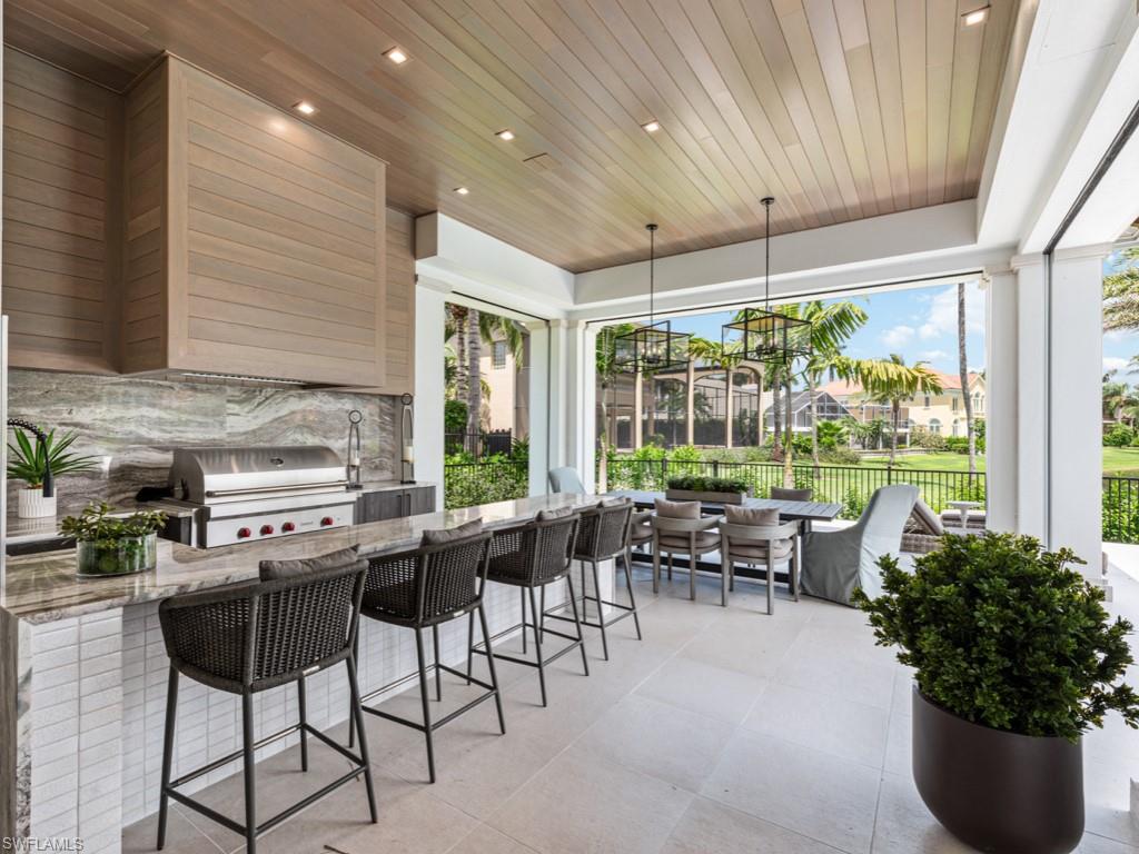 349 Colony Drive Naples, FL 34108 - Photo 44 of 48 Sunroom featuring wooden ceiling