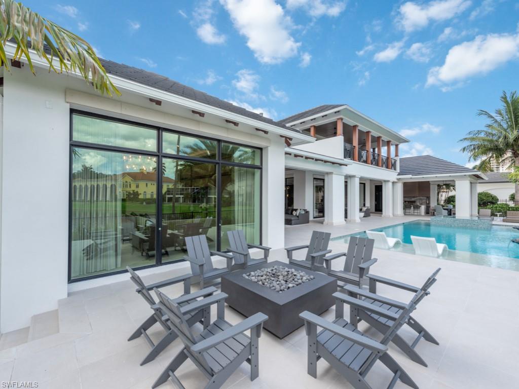 349 Colony Drive Naples, FL 34108 - Photo 45 of 48 View of pool featuring a fire pit and a patio area