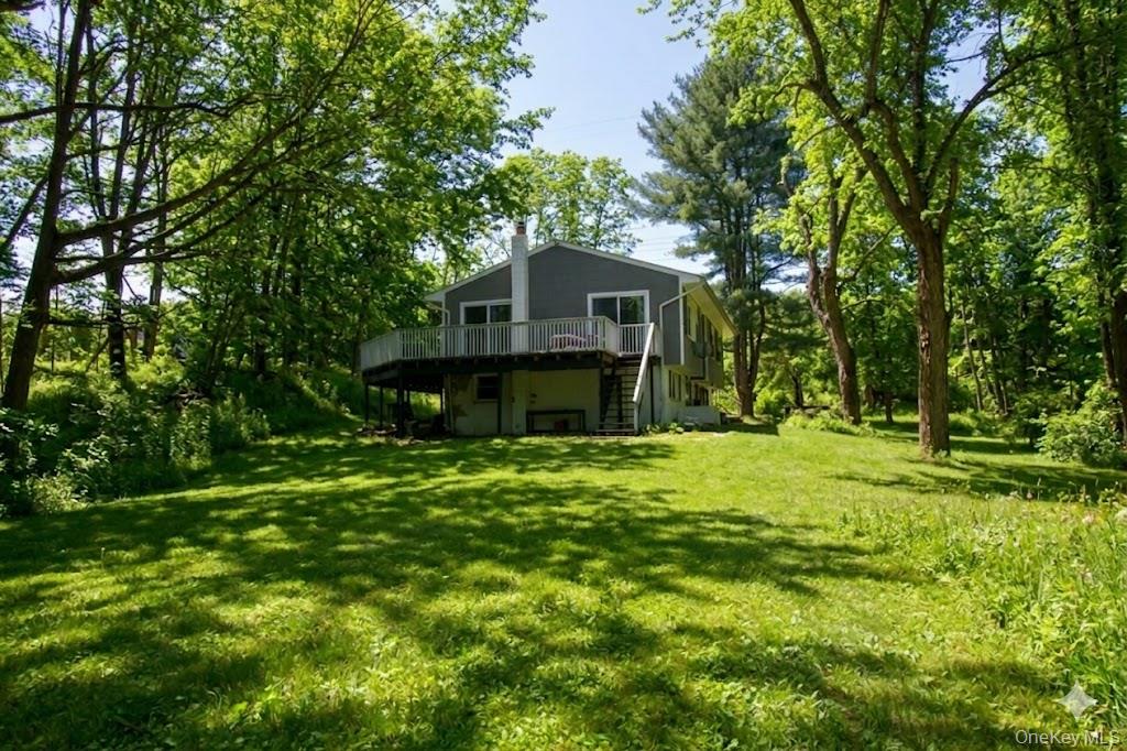 182 Downing Road Pleasant Valley, NY 12569 - Photo 22 of 29 with wrap around deck. (digital enhanced to reflect spring foliage)