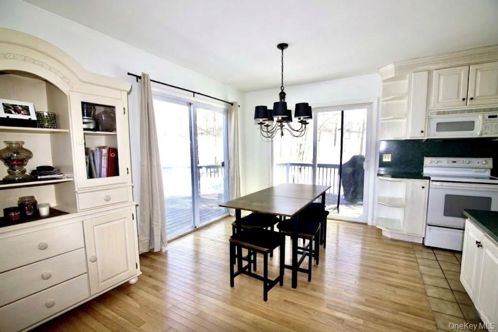 182 Downing Road Pleasant Valley, NY 12569 - Photo 4 of 29 lots of light from sliding doors opening to wrap around deck