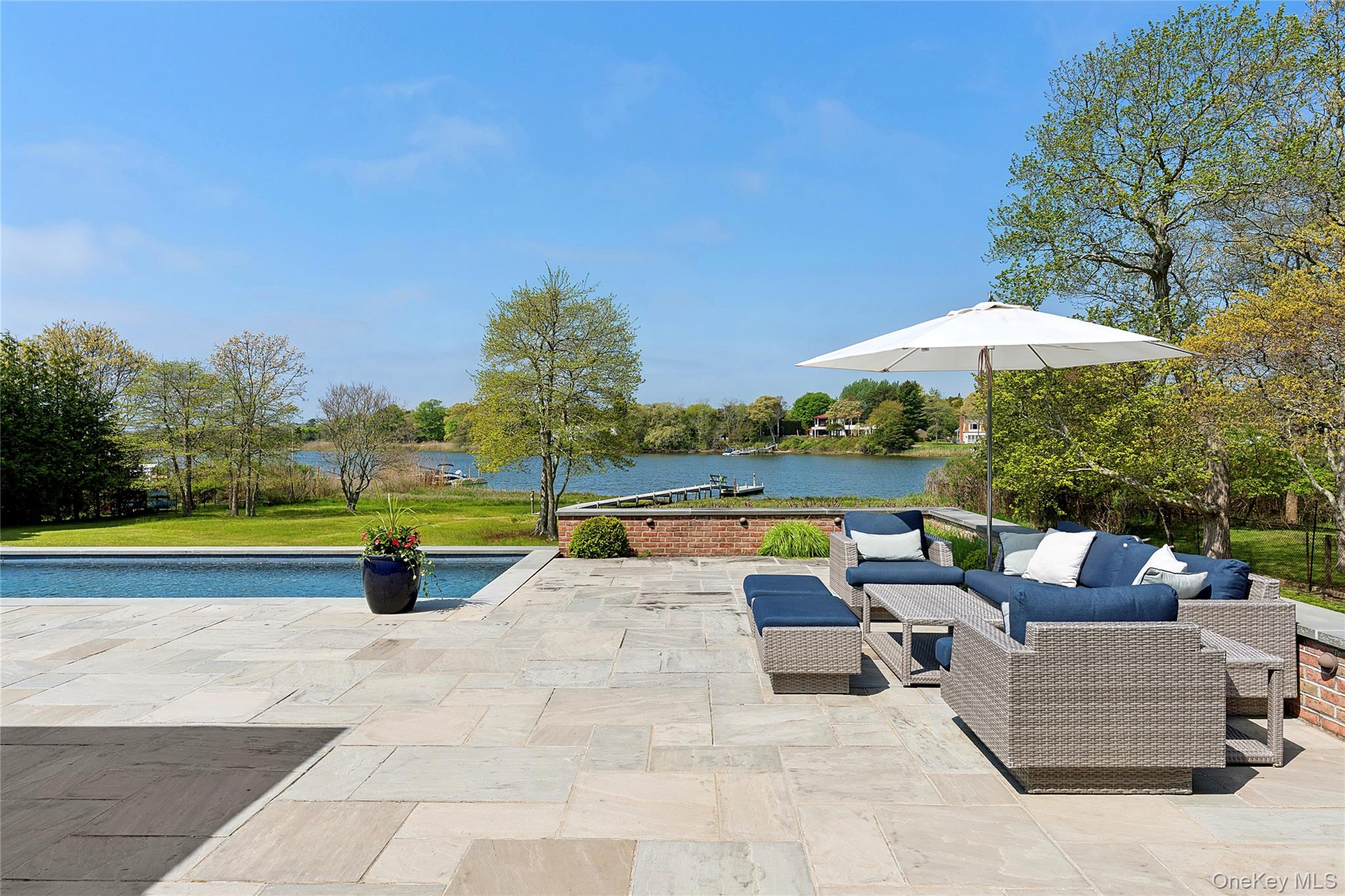43 Old Main Road Quogue, NY 11959 - Photo 27 of 28 a view of swimming pool with lounge chair in the patio