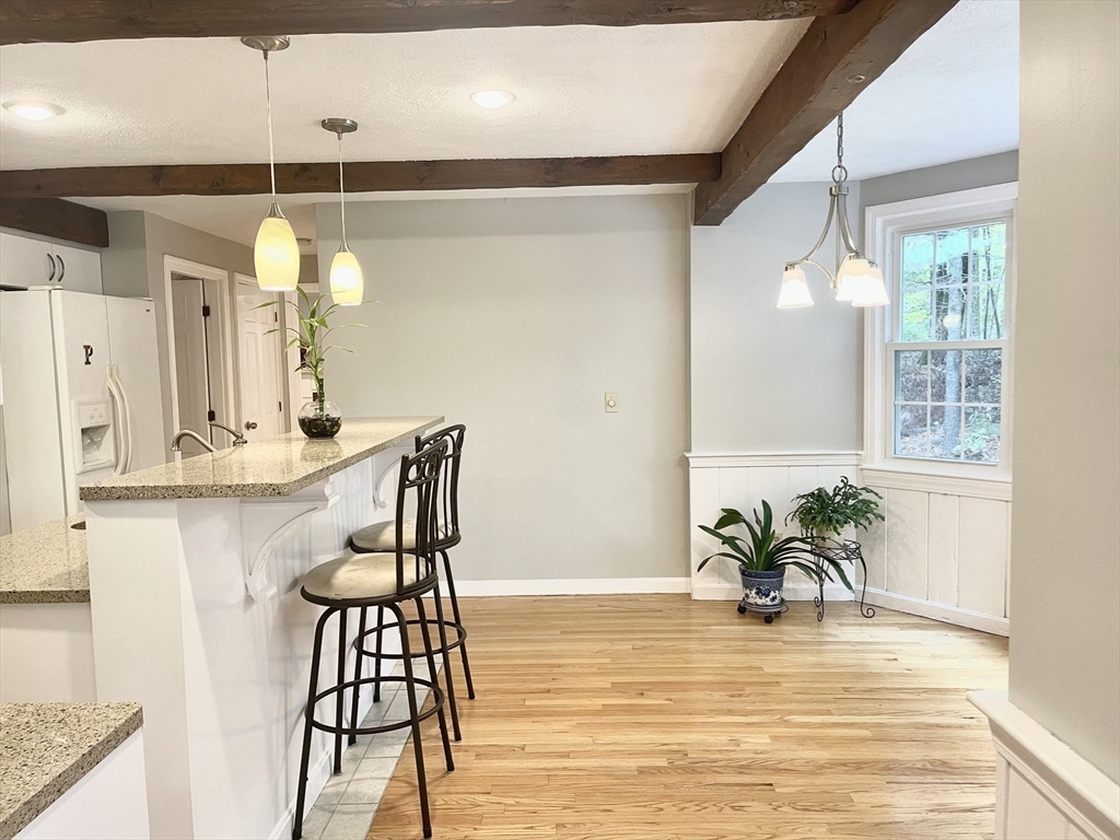 42 Jackson Drive Acton, MA 01720 - Photo 14 of 39 a view of a dining room with furniture and wooden floor