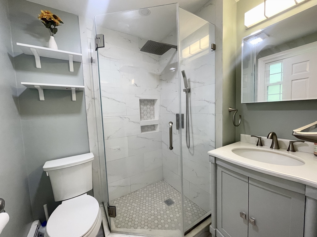 42 Jackson Drive Acton, MA 01720 - Photo 24 of 39 a bathroom with a sink toilet and shower