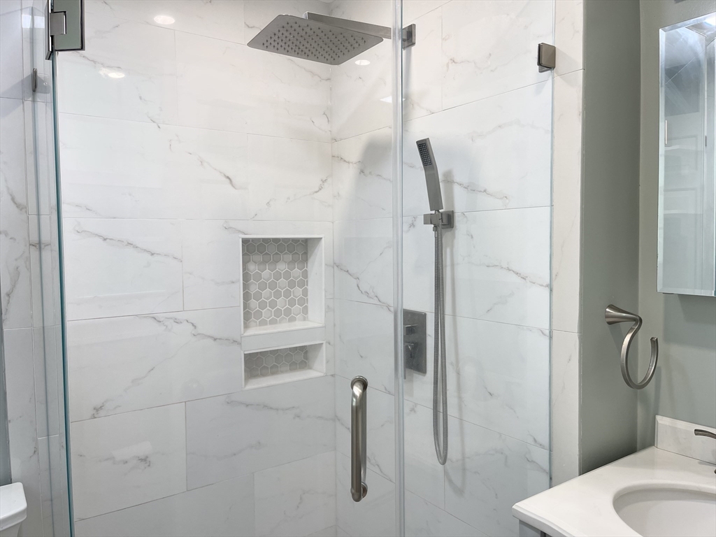 42 Jackson Drive Acton, MA 01720 - Photo 25 of 39 a bathroom with a shower and toilet