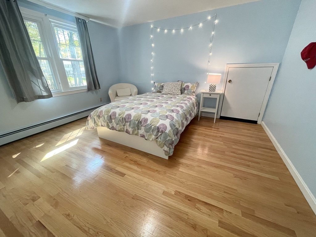 42 Jackson Drive Acton, MA 01720 - Photo 26 of 39 a bedroom with a large bed and a window