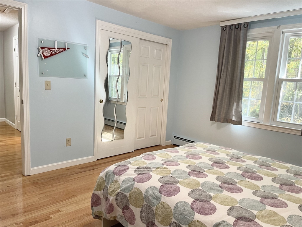 42 Jackson Drive Acton, MA 01720 - Photo 28 of 39 a bedroom with a bed and a window