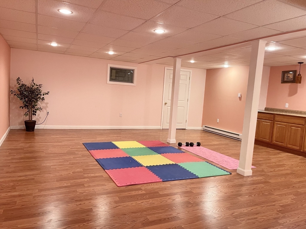 42 Jackson Drive Acton, MA 01720 - Photo 34 of 39 a room with pool table and wooden floor