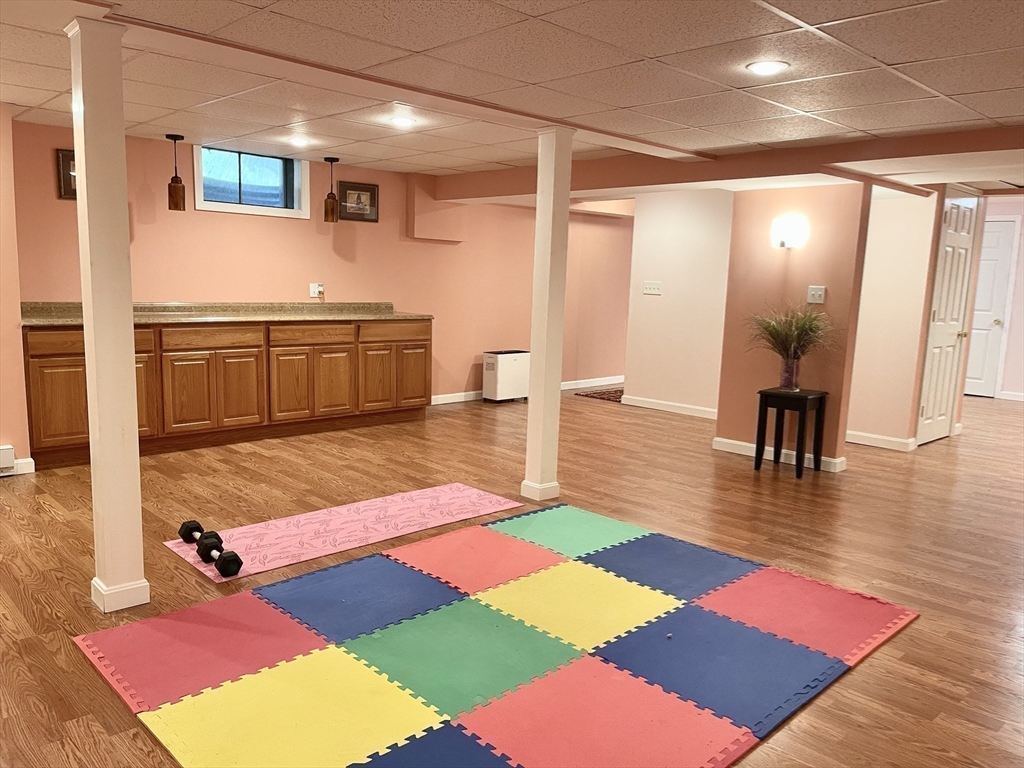 42 Jackson Drive Acton, MA 01720 - Photo 35 of 39 a rug sitting area with a rug