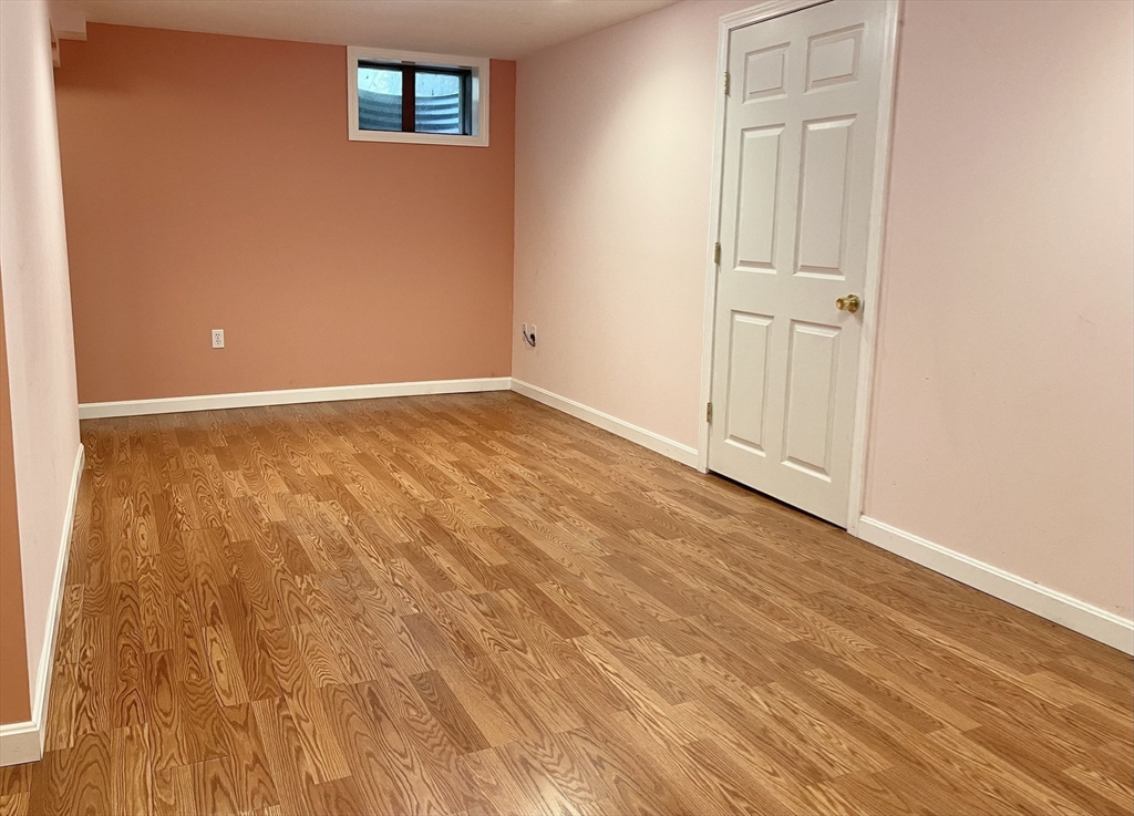 42 Jackson Drive Acton, MA 01720 - Photo 36 of 39 an empty room with wooden floor and closet