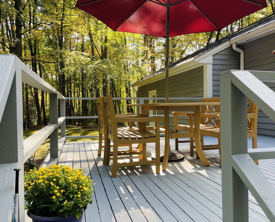 42 Jackson Drive Acton, MA 01720 - Photo 38 of 39 a view of a balcony with chairs and wooden floor