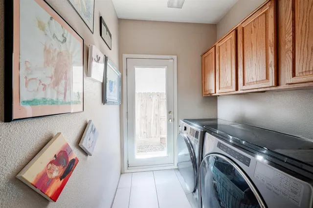 a view of a kitchen with washer and dryer