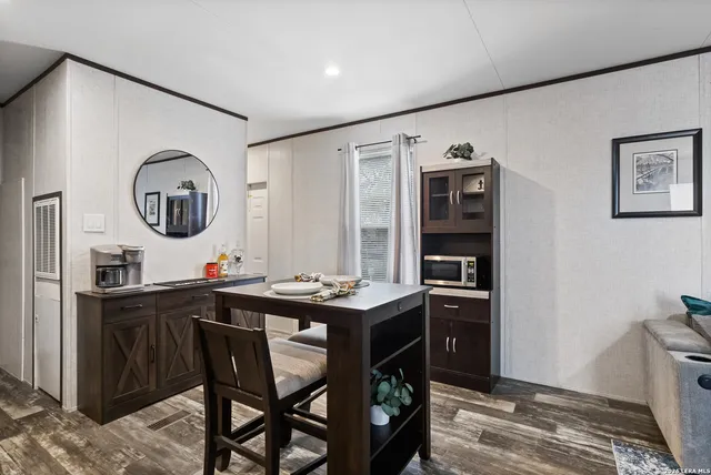 a kitchen with a sink appliances and cabinets
