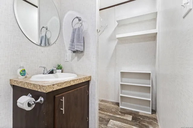 a bathroom with a sink and a mirror