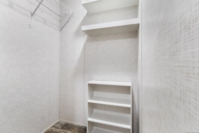 a view of an empty walk in closet