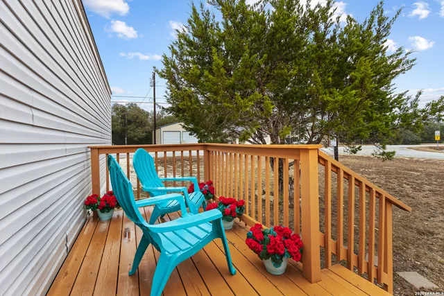 a view of a chairs on the roof deck
