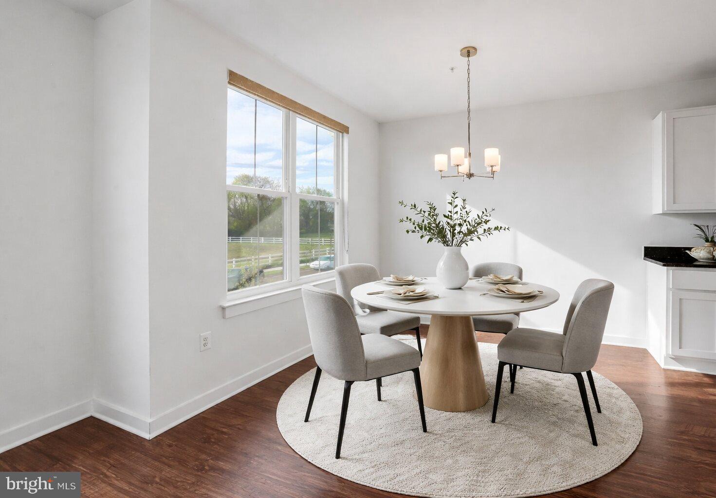 1203 Furgeson Lane Frederick, MD 21702 - Photo 9 of 16 a view of a dining room with furniture window and wooden floor