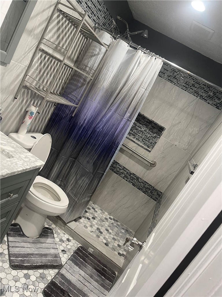 603 Liberty Road Youngstown, OH 44505 - Photo 13 of 42 Full bath featuring vanity and a stall shower