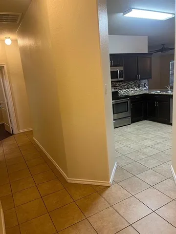 a view of kitchen with cabinets and wooden floor