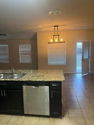 a bathroom with a sink a vanity and a window
