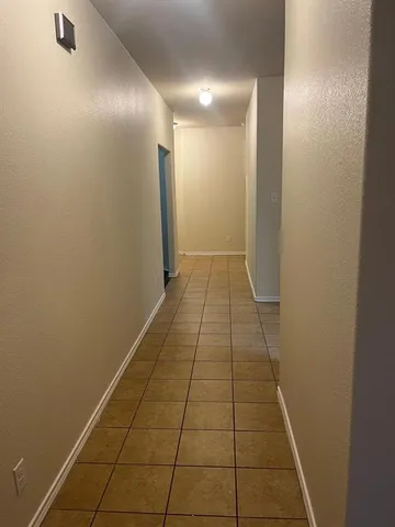 a kitchen with granite countertop a sink and cabinets